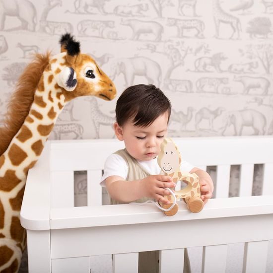 Dřevěná tahací hračka vyrobená z bukového dřeva s bavlněnou šňůrkou se vzorem žirafy.