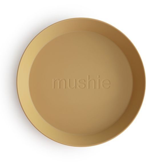 Mushie Kulatý talíř 2ks MUSTARD