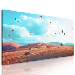 Obraz lístie vejúce jesennou krajinou