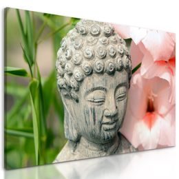 Obraz socha Budhu v kvetinovej záhrade