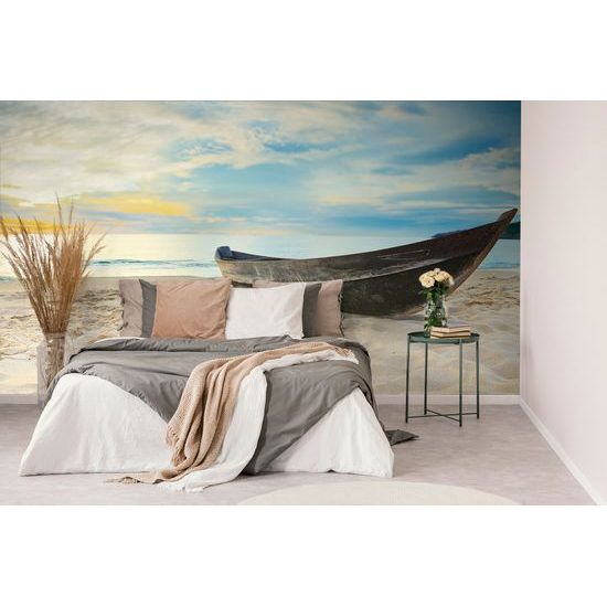 Samolepiaca fototapeta osamelá loďka na pláži