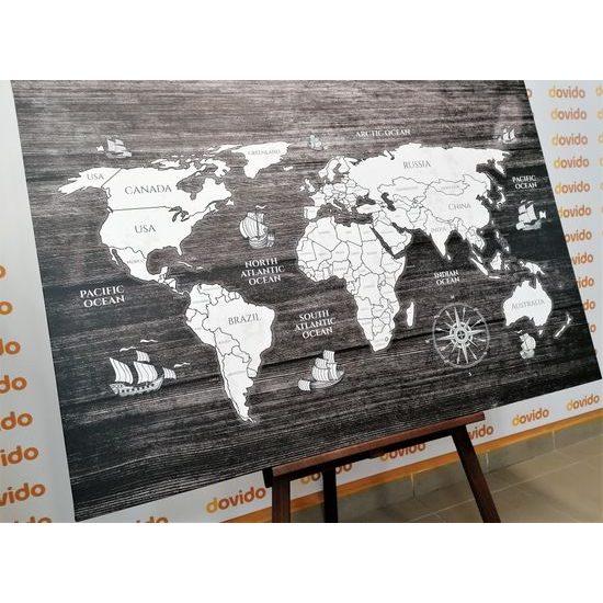 Obraz čiernobiela mapa sveta s dreveným pozadím