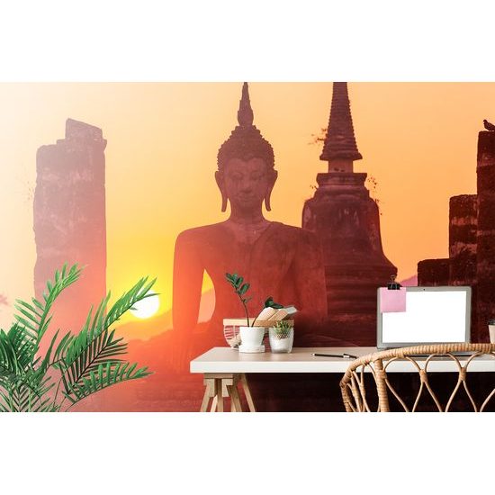 Fototapeta socha Budhu pri východe slnka