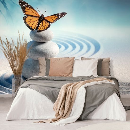 Samolepiaca fototapeta súlad motýľa s kameňmi na abstraktnom pozadí