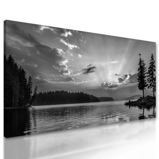 Obraz slnko predierajúce sa cez oblaky v čiernobielom prevedení