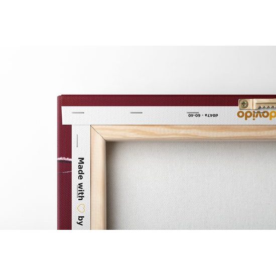 Obraz krásna vianočná guľa na červenom pozadí