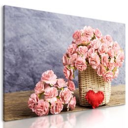 Obraz nádherná kytice karafiátů v proutěném košíku