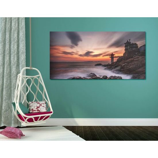 Obraz slunce zapadající za maják