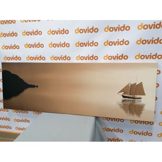 Obraz loďka na širém moři v sépiovém provedení