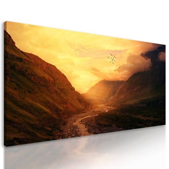 Obraz slunce zapadající za kopce