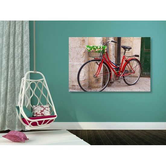 Obraz staré kolo v Italském městečku