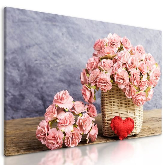 Obraz nádherná kytice karafiátů v proutěném košíku