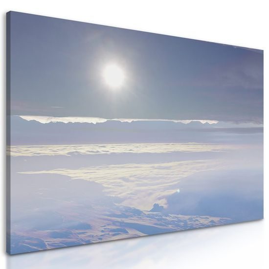 Obraz slunce nad zamlženou krajinou