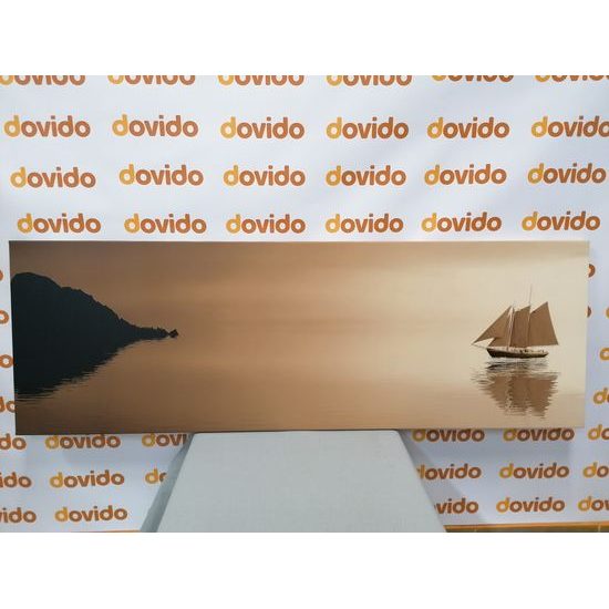 Obraz loďka na širém moři v sépiovém provedení