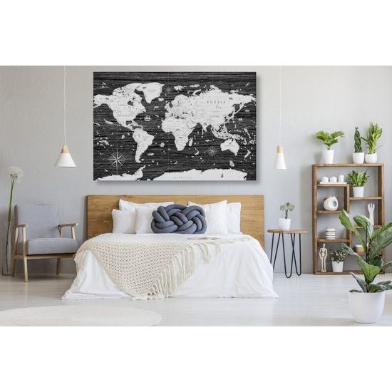 Obraz na korku historická mapa světa na dřevěném pozadí v černobílém provedení