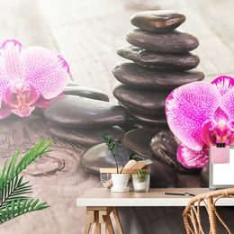 Öntapadó tapéta orchidea és Zen kövek egy fából készült háttéren