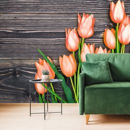 Öntapadó fotótapéta narancssárga tulipánok fa háttéren