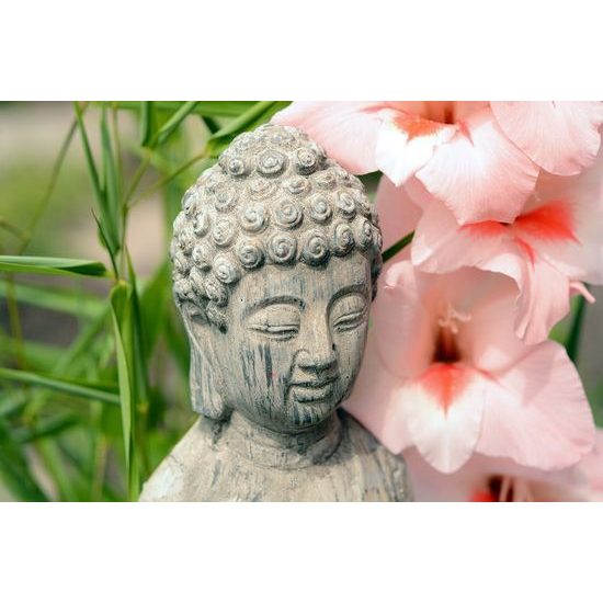 Fotótapéta Buddha szobor virágok közelében