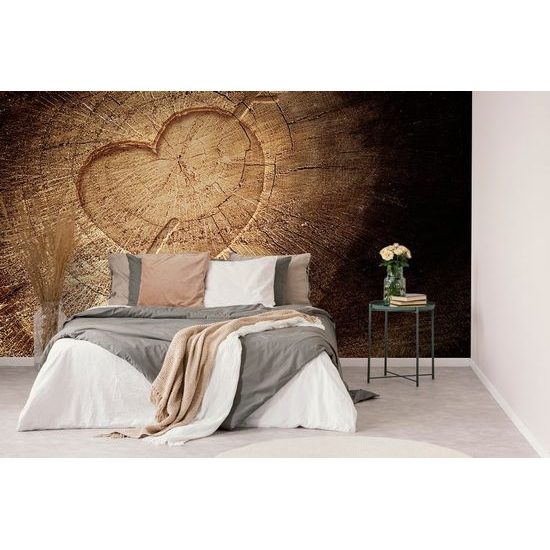 Öntapadó fotótapéta szív nyíllal egy fatönkön