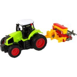 Zelený traktor s pluhem na dálkové ovládání