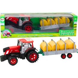 Velký zemědělský traktor s přívěsem a balíky sena 80cm