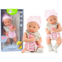 Panenka miminko v bílo-růžovém oblečení s bryndákem, dudlíkem a dekou