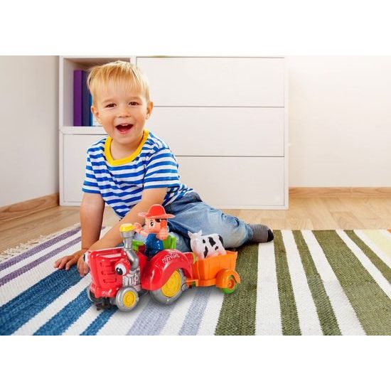 Veselý traktor pro nejmenší se světly a zvuky Cartoon Tractor oranžový