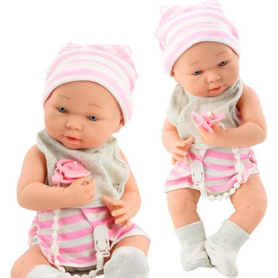 Panenka miminko v bílo-růžovém oblečení s bryndákem, dudlíkem a dekou