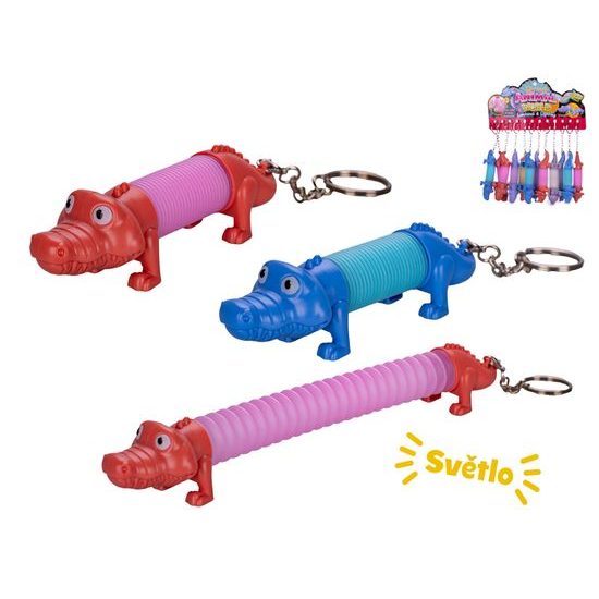 Krokodýl natahovací 11-21cm/přívěsek na klíče na baterie se světlem 3barvy 12ks na kartě